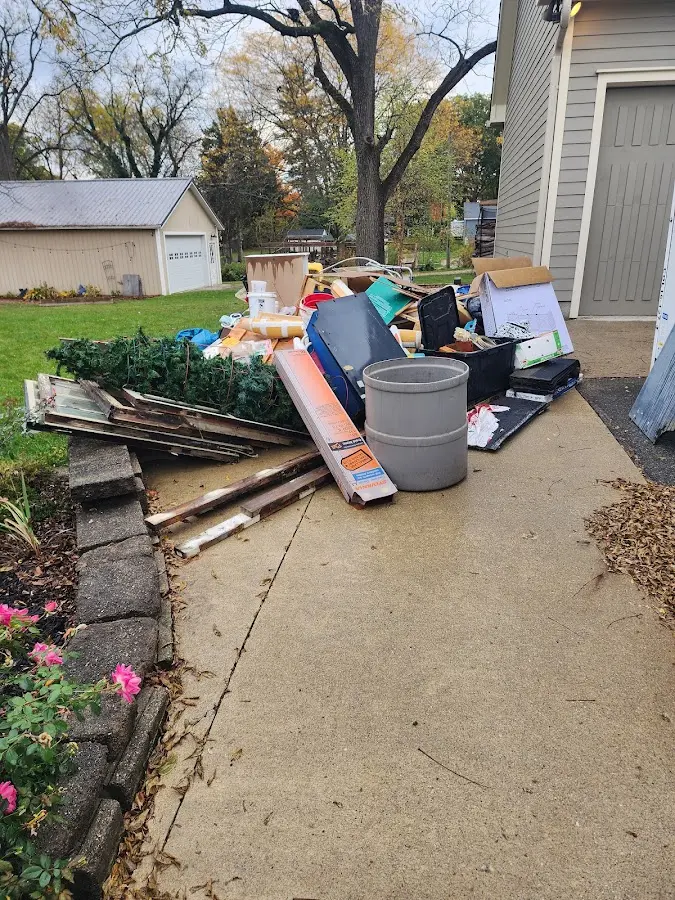 Dumpster being loaded with debris for Residential Dumpster Rental in Norwich